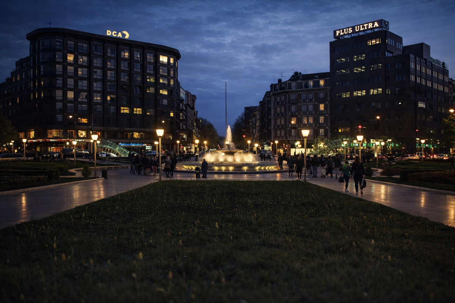 Praça urbana à noite com fonte iluminada